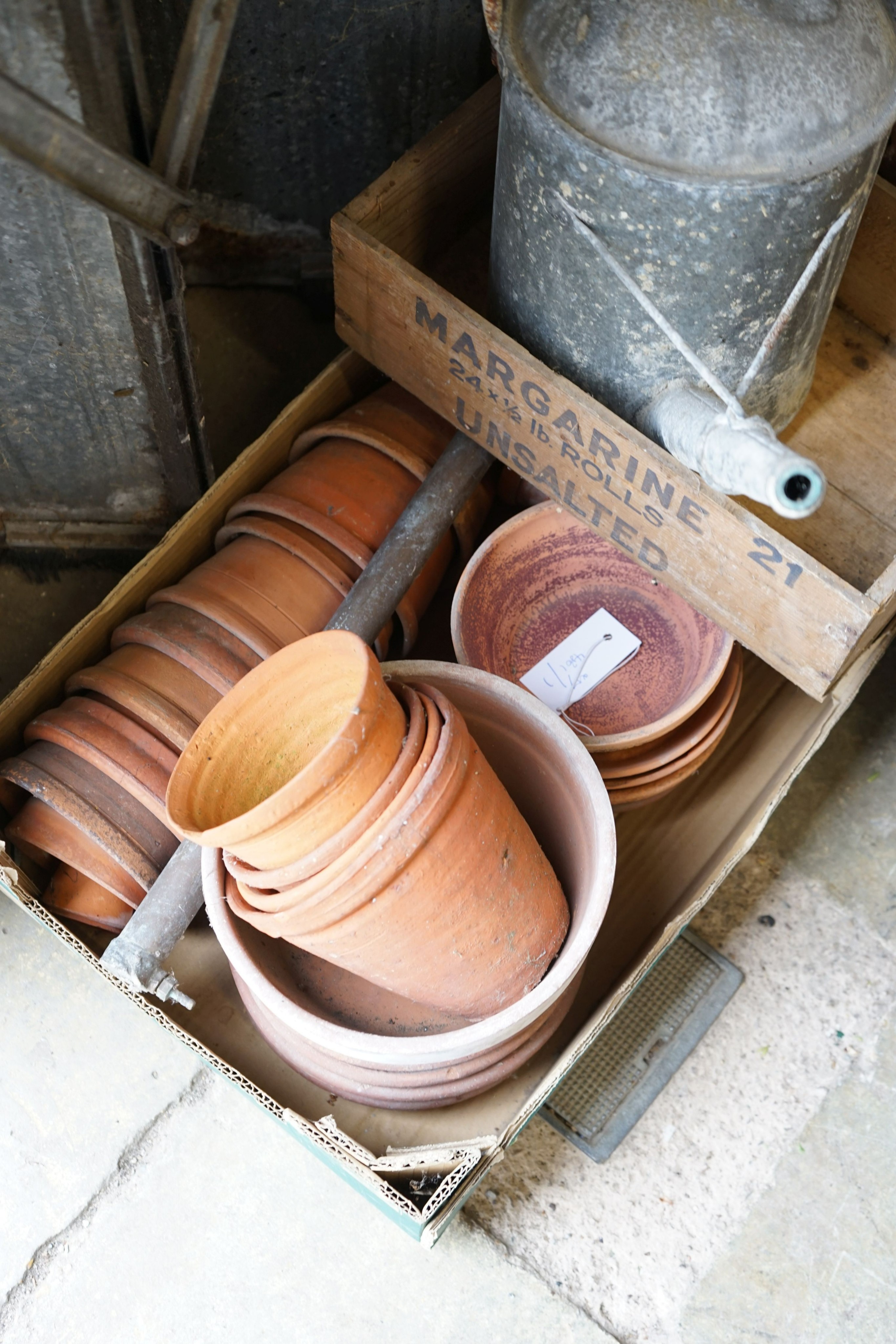 A quantity of vintage terracotta pots, two galvanised cans, bucket and two wood crates